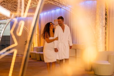 Couple running in the sauna area